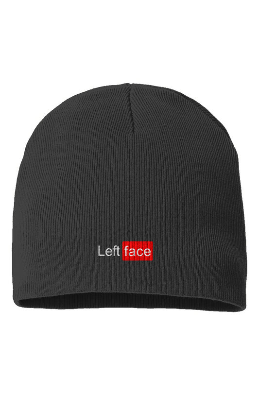 Black ribbed beanie featuring an embroidered Left Face logo on the front. The word “Left” is stitched in white, and “face” appears in white text inside a bold red rectangle.